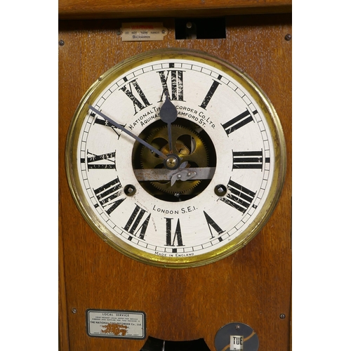 112 - An oak cased National Time Recorder Co clocking-in machine, 34 x 28cm, 88cm high