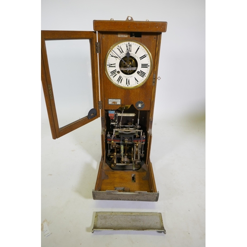 112 - An oak cased National Time Recorder Co clocking-in machine, 34 x 28cm, 88cm high