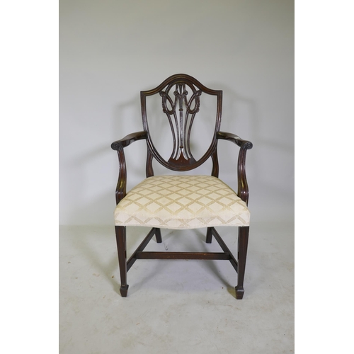 1123 - A pair of Hepplewhite style shield back mahogany elbow chairs, late C19th/early C20th