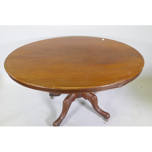 1125 - A Victorian mahogany tilt top loo table, raised on a turned column and cabriole supports, 132 x 100 ... 