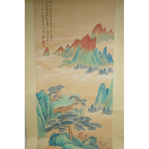 113 - A Chinese watercolour scroll depicting a figure in an extensive mountainous landscape, 49 x 98cm