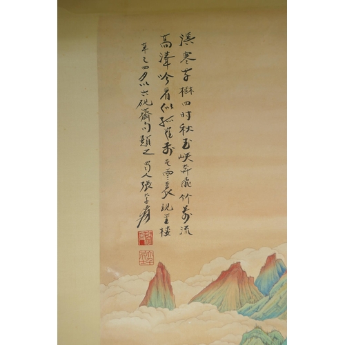 113 - A Chinese watercolour scroll depicting a figure in an extensive mountainous landscape, 49 x 98cm