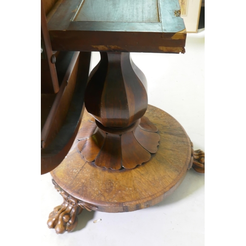 1134 - A C19th rosewood tilt top breakfast table, raised on a shaped column with carved detail and platform... 