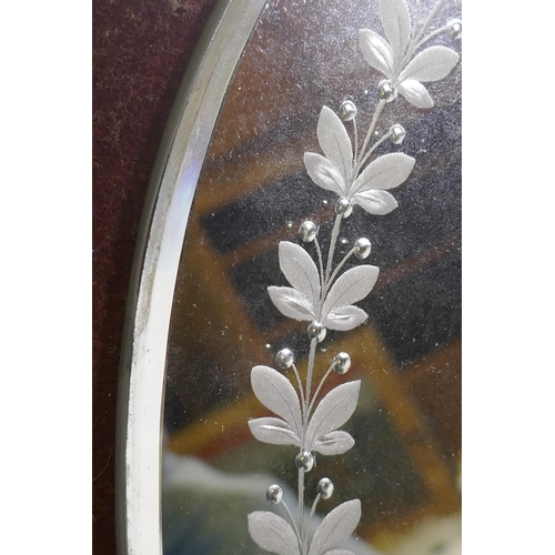 1135 - William Tonks & Sons, a pair of Victoria girandoles, the mirrors etched and engraved with traili... 