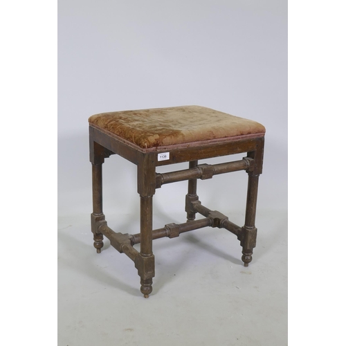 1136 - A good quality antique oak stool, raised on turned supports united by stretchers and pegged joints, ... 