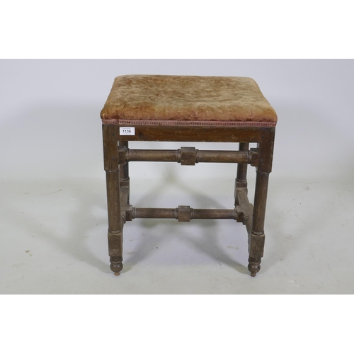 1136 - A good quality antique oak stool, raised on turned supports united by stretchers and pegged joints, ... 