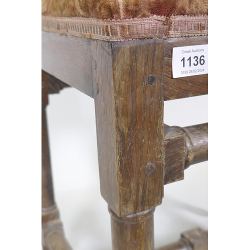 1136 - A good quality antique oak stool, raised on turned supports united by stretchers and pegged joints, ... 