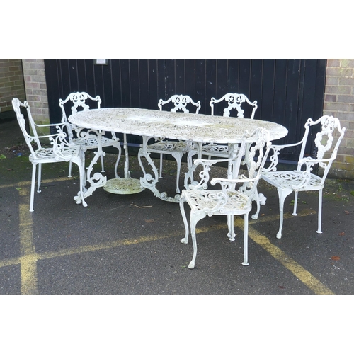 1165 - A painted metal garden table and six chairs ensuite