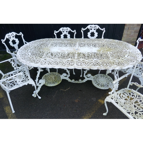 1165 - A painted metal garden table and six chairs ensuite