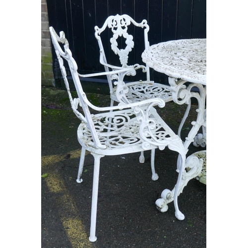 1165 - A painted metal garden table and six chairs ensuite