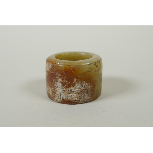 118 - A Chinese crystal archers thumb ring, with engraved dragon decoration, and a nephrite jade thumb rin... 