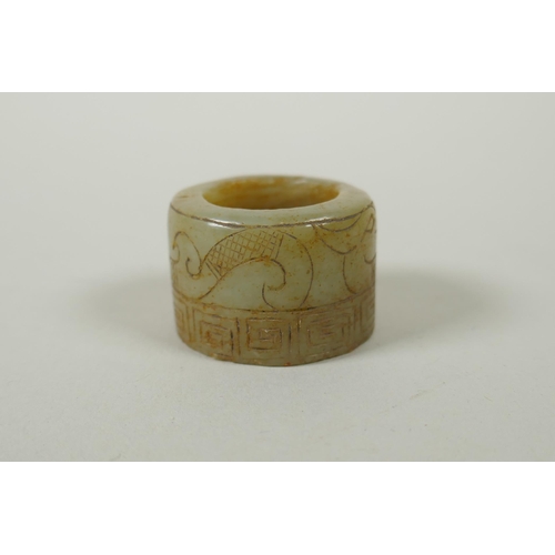 118 - A Chinese crystal archers thumb ring, with engraved dragon decoration, and a nephrite jade thumb rin... 