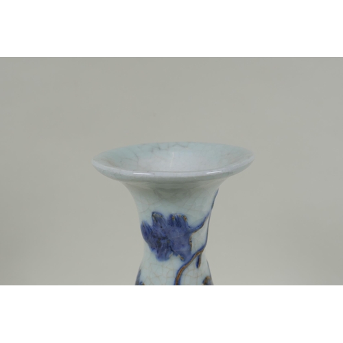 119 - A Chinese crackleware pear shaped vase with raised blue and red grape vine decoration, 25cm high