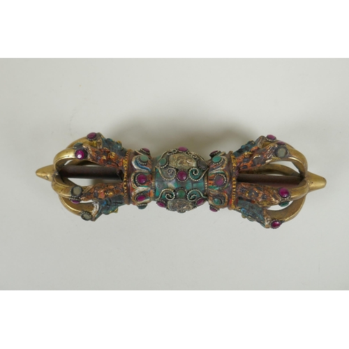 120 - A Tibetan cold painted bronze vajra with inset stone decoration, 23cm long