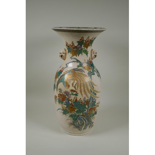 122 - A Japanese Meiji Satsuma vase, with twin mask handles, decorated with a phoenix in flight, 48cm high