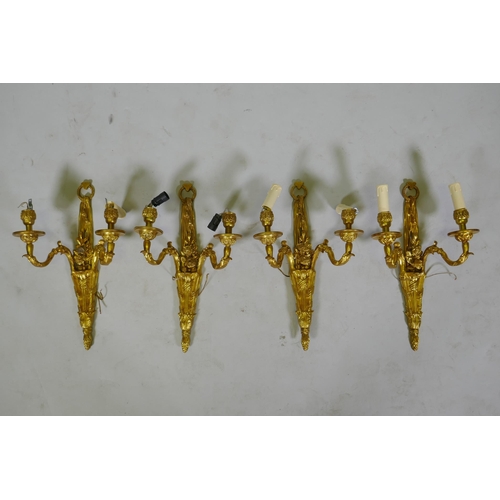 124 - Four ormolu Louis XVI style two branch wall sconces, 44cm high