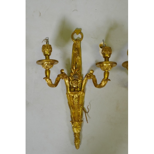 124 - Four ormolu Louis XVI style two branch wall sconces, 44cm high