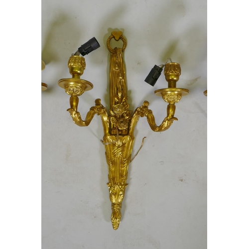 124 - Four ormolu Louis XVI style two branch wall sconces, 44cm high