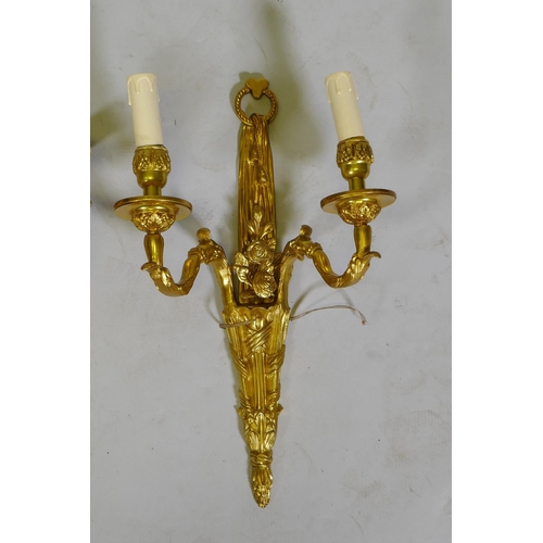 124 - Four ormolu Louis XVI style two branch wall sconces, 44cm high