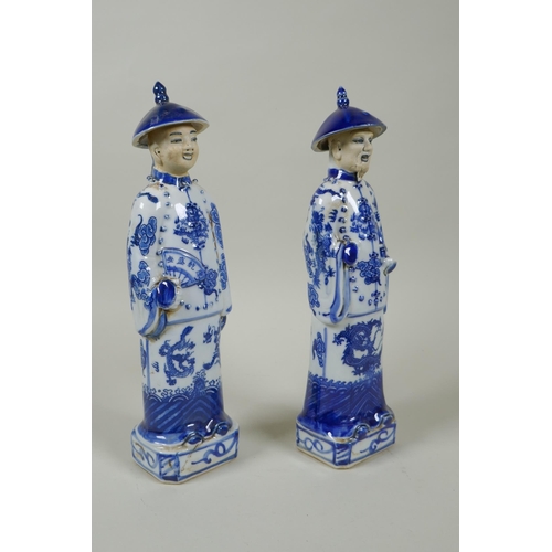 125 - A pair of Chinese Qing dynasty blue and white figures, impressed marks to base, 26cm high