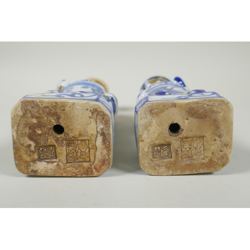 125 - A pair of Chinese Qing dynasty blue and white figures, impressed marks to base, 26cm high