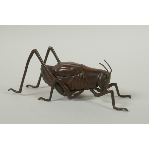 128 - A Japanese style bronze okimono grasshopper, 17cm long