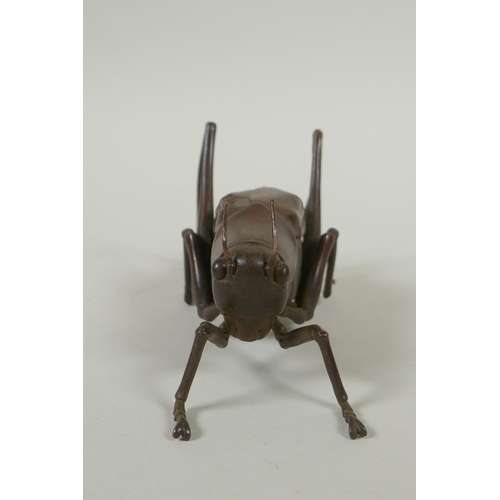 128 - A Japanese style bronze okimono grasshopper, 17cm long