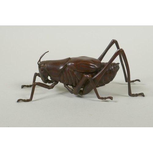 128 - A Japanese style bronze okimono grasshopper, 17cm long