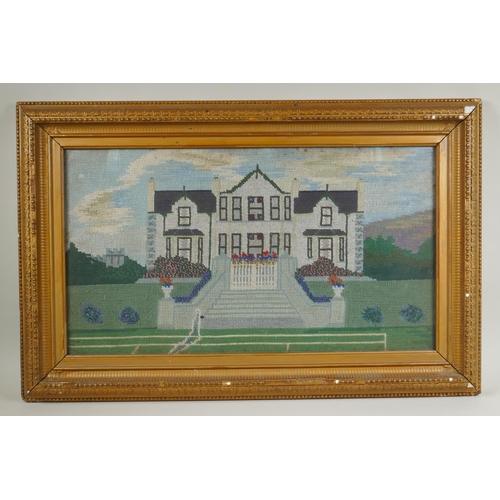 132 - An early C20th naive wool work of a country house and tennis court, 61 x 35cm