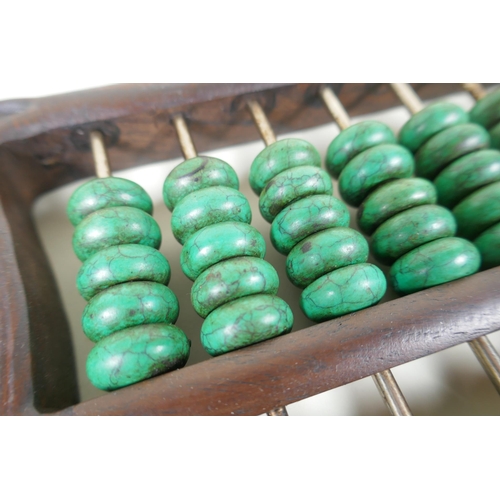 133 - A Chinese hardwood abacus with turquoise beads, 41 x 14cm