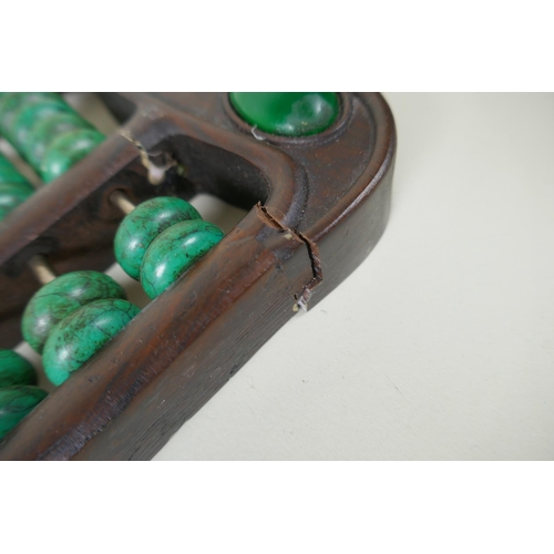 133 - A Chinese hardwood abacus with turquoise beads, 41 x 14cm