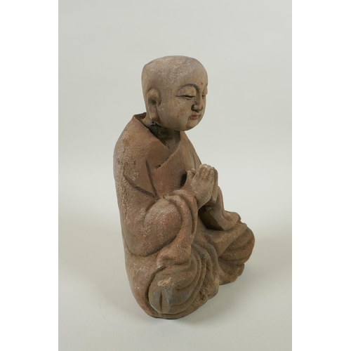 135 - A Chinese carved and painted wood figure of Buddha, 23cm high