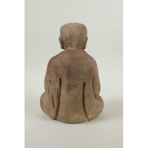 135 - A Chinese carved and painted wood figure of Buddha, 23cm high