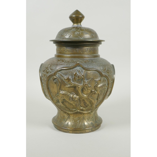 136 - A Chinese gilt bronze meiping jar and cover, with raised decorative panels depicting asiatic animals... 