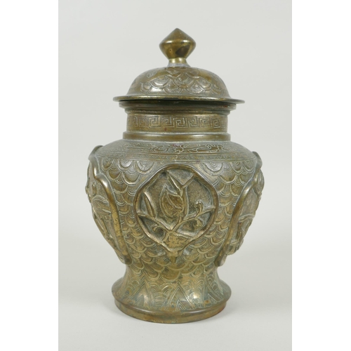 136 - A Chinese gilt bronze meiping jar and cover, with raised decorative panels depicting asiatic animals... 