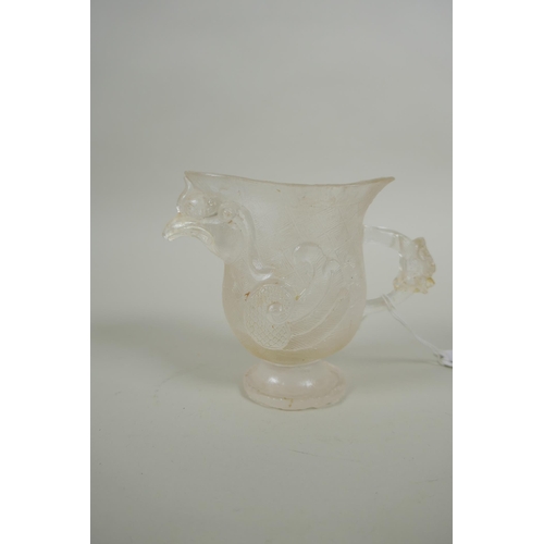 140 - A Chinese moulded glass libation cup in the form of a phoenix, 10cm high