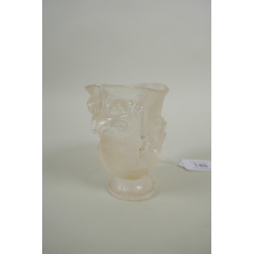 140 - A Chinese moulded glass libation cup in the form of a phoenix, 10cm high