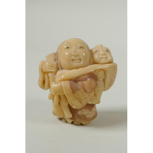 143 - A Japanese carved boxwood rat netsuke, together with two carved tagua nut netsuke in the form of a m... 