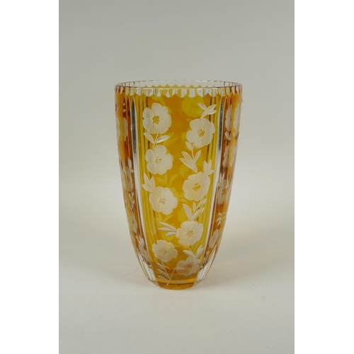 144 - A Bohemian amber cut glass vase with floral decoration, 23cm high