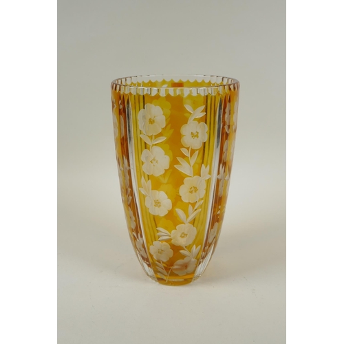 144 - A Bohemian amber cut glass vase with floral decoration, 23cm high