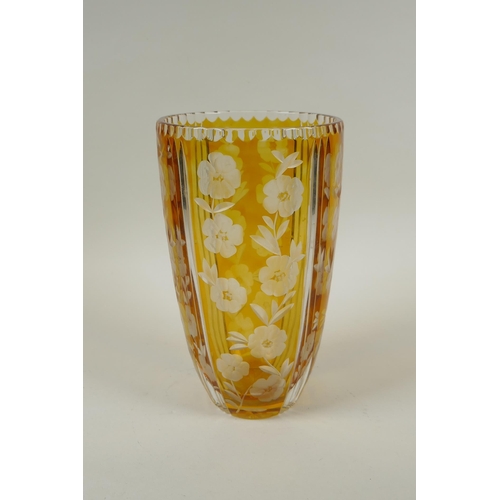 144 - A Bohemian amber cut glass vase with floral decoration, 23cm high