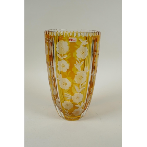 144 - A Bohemian amber cut glass vase with floral decoration, 23cm high