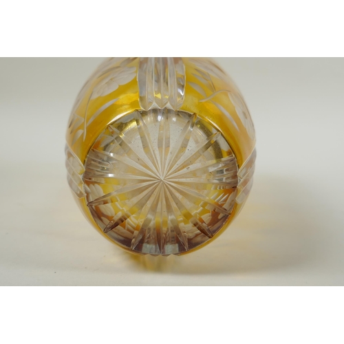 144 - A Bohemian amber cut glass vase with floral decoration, 23cm high