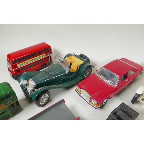 146 - A collection of diecast metal scale model cars including Burago, Matchbox, Dinky, Corgi etc, largest... 