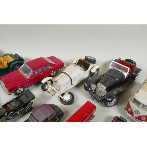 146 - A collection of diecast metal scale model cars including Burago, Matchbox, Dinky, Corgi etc, largest... 