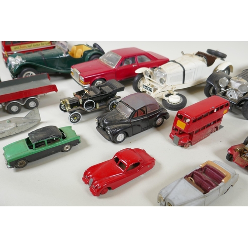 146 - A collection of diecast metal scale model cars including Burago, Matchbox, Dinky, Corgi etc, largest... 