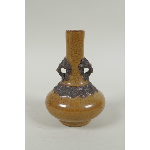 148 - An antique Chinese crackleware bottle vase with two lion mask loop handles, 13cm high