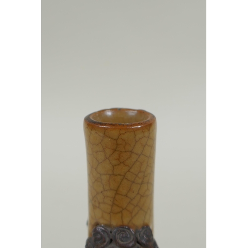 148 - An antique Chinese crackleware bottle vase with two lion mask loop handles, 13cm high