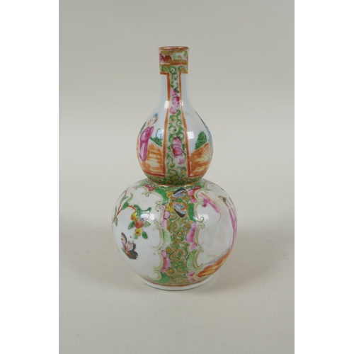 149 - A C19th Chinese Canton famille rose porcelain double gourd vase, with decorative panels depicting fi... 