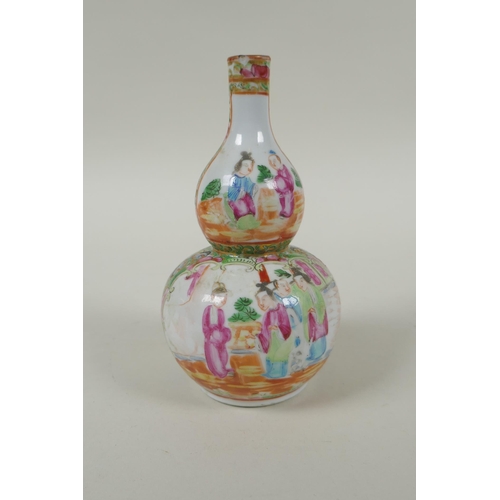 149 - A C19th Chinese Canton famille rose porcelain double gourd vase, with decorative panels depicting fi... 